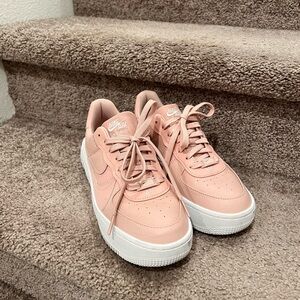 Nike Pink Sneakers with White Soles and Low-Top Design